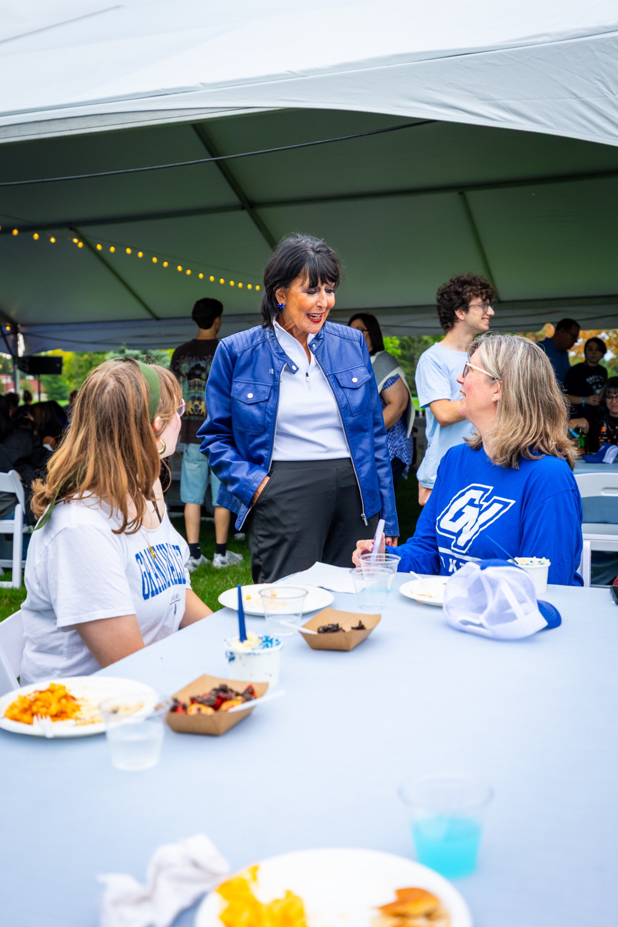 President Philly talking to a mother and student